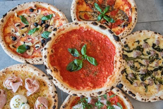 fresh margherita pizza with basil and tomatoes